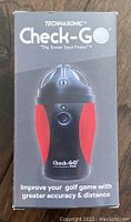 Front view of the Technasonic Check-Go box showing the product, model name, and image of the device