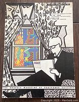RAW Volume 1 Number 1 magazine with monochrome cover featuring a man reading by a window with abstract art.