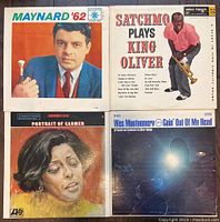Four jazz LP albums: Maynard '62, Satchmo Plays King Oliver, Portrait of Carmen, Wes Montgomery - Goin' Out Of My Head.