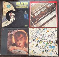 Photo of four LP records featuring Elvis Presley, The Beatles, David Bowie, and Led Zeppelin.
