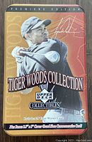 Front of tin box showing 'Premiere Edition Tiger Woods Collection' with image of Tiger Woods swinging a golf club