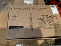 Top of box labeled Large Full-Motion TV Wall Mount with Perlesmith logo