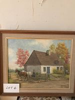 Full front view of the framed oil painting depicting a rural farmhouse scene