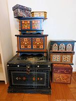 Full view of eight stacked decorative boxes