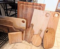 Full view of the lot with all 11 wooden items displayed together showing variety in size, shape and wood tone.