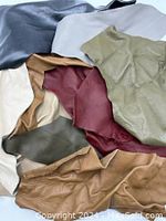 Top view of assorted leather pieces in diverse colors and textures