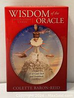Front packaging of Wisdom of the Oracle divination card set showing title, illustration, and author.