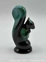 Miniature Blue Mountain Pottery squirrel figurine, ceramic with green and black glaze, side view showing the tail