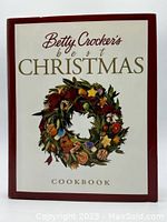 Front cover of Betty Crocker's Best Christmas Cookbook with festive wreath illustration.