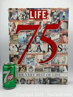 Front cover of the LIFE 75 Years coffee table book showing a collage of past LIFE magazine covers and large red '75 Years' text with a 7-Up can for scale.