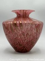 Full view of rose and gold art glass vase showing color and shape