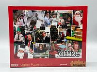 Front of the puzzle box showing the title, branding, and Christmas themed collage images from The Office TV show.