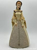 Front view of the Tudor lady figurine showing detailed ornate gown and facial features.