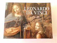 Front cover of the softcover book with a color image of Leonard Da Vinci artwork.