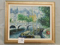 Full front view of framed oil painting showing Paris cityscape with river, boats and bridge