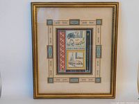 Full front view of framed painting showing decorative border and central motifs