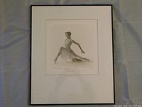 Full view of framed photographic print showing the dancer in seated pose and entire frame.