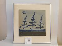 Front view of the framed ceramic tile wall art showing the full artwork and signature.