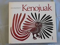 Front cover of the hardcover book 'Kenojuak' by Jean Blodgett, showing the stylized owl artwork in red and black.