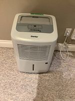Front view of Danby dehumidifier showing brand and air vent.