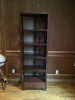 Front view showing five shelves and bottom drawer