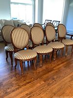 Eight chairs arranged in two rows, showing overall set composition
