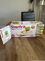 Starfrit Easy Mandoline slicer in original box showing product image and features list.