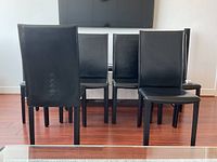 Rear view of all six chairs showing corset tie lacing on backrests