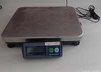 Front view of the Mettler Toledo Viva Ram bench scale showing stainless steel platform and digital display with model name and buttons.