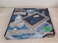 Closed original box of the Medion PC USB Graphics Tablet showing product image and features.