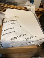 Photo of partially opened ream showing the inner packaging with International Paper branding and the paper sheets inside.