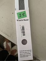 Photo of the watch band packaging showing 'Watch Band' text and some marketing points about the product.