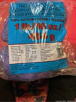 Packaging label showing weight and material: 100% cotton, 1 lb 16 oz (854 g) per roll