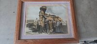 Full view of framed picture showing Abraham Lincoln and a group of people near a locomotive.