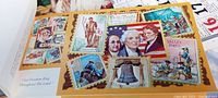 Photo showing a postcard with portraits of prominent American figures, Liberty Bell, Valley Forge, and other patriotic imagery