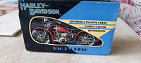 Closed box showing front label with Harley-Davidson historical motorcycle image and set years 1903-1960.