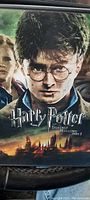 Close-up of Harry Potter and the Deathly Hallows Part 2 DVD game case with artwork showing Harry Potter's face.