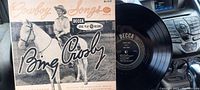 Record in its original paper sleeve showing Bing Crosby on horseback and original Decca branding