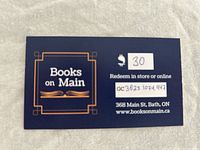 Front view of the Books On Main $30 gift card showing logo, card value, card number, and redemption information.