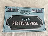 Photo of Kingston Writers Fest 2024 Festival Pass card showing design and text.