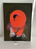 Front view of the original canvas print featuring abstract art with a large orange circular element covering the figure's head.