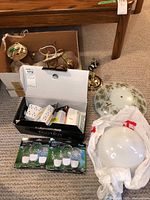 Photo showing the wall lights, ceiling light fixture, glass ceiling light shade, electrical plug expanders, and LED night lights