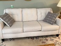 Front view of full sofa with both throw pillows