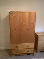 Full front view of wardrobe with doors and drawers closed