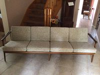 Full front view showing all four cushions and wood frame