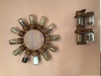 Front view of circular and vertical wooden spice racks mounted on wall