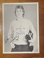 Full view of signed Wayne Gretzky advertising photo wearing GWG Jeans sweatshirt holding skates