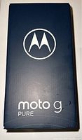 Front view of sealed Motorola Moto G Pure box with logo and model name on deep indigo colored box.