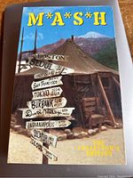 Front cover of the M*A*S*H Collectors Edition VHS showing the tent and directional signpost artwork.