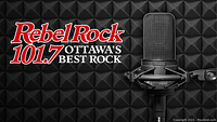 Rebel Rock 101.7 branding displayed with microphone against soundproof foam panel background